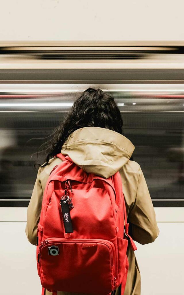 Girl standing in front of a train in Adelaide